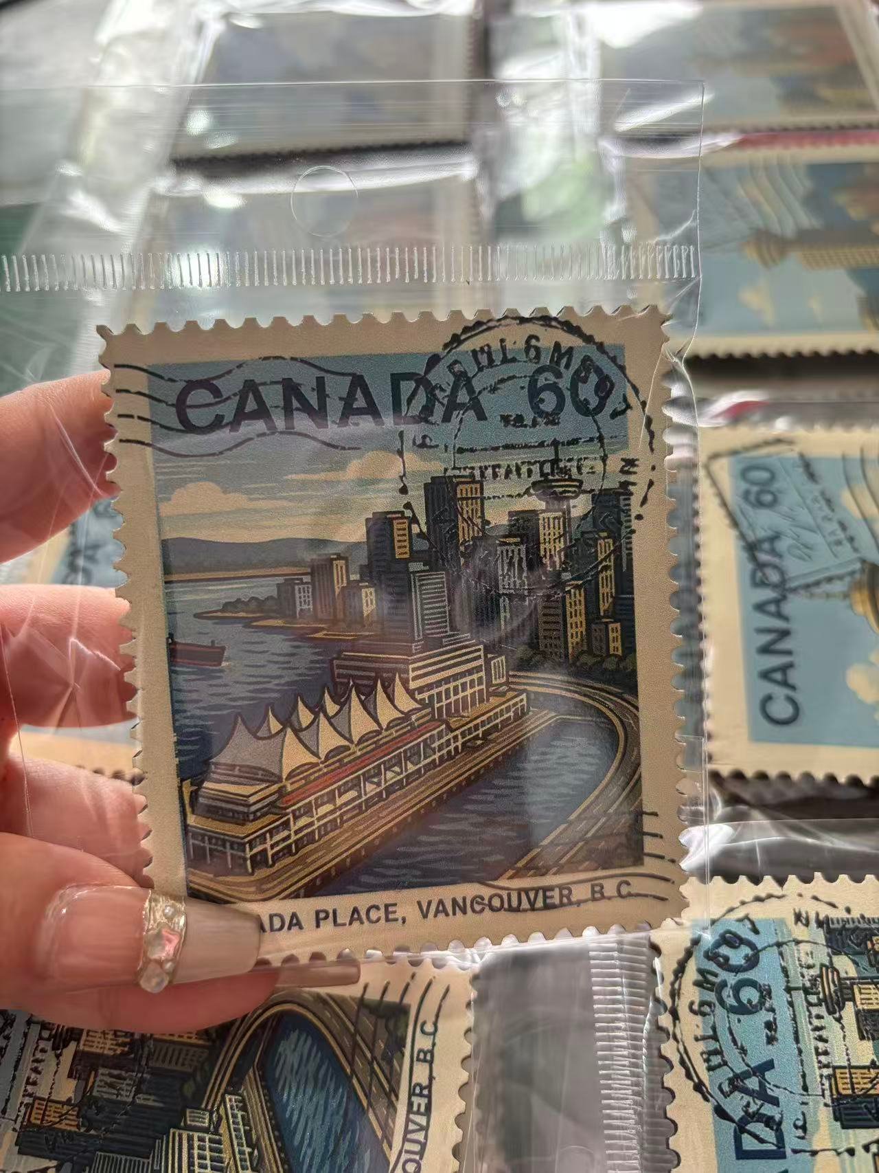 Stamp souvenir magnet held in hand showing custom design and serrated edge detail