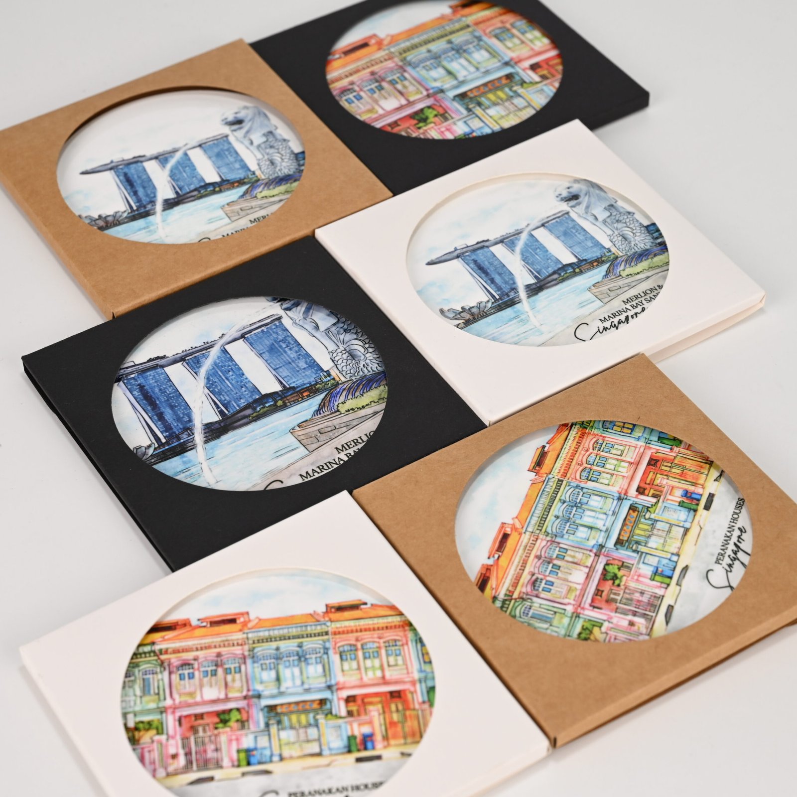 Custom MDF sublimation coasters in square and round format showing various client designs