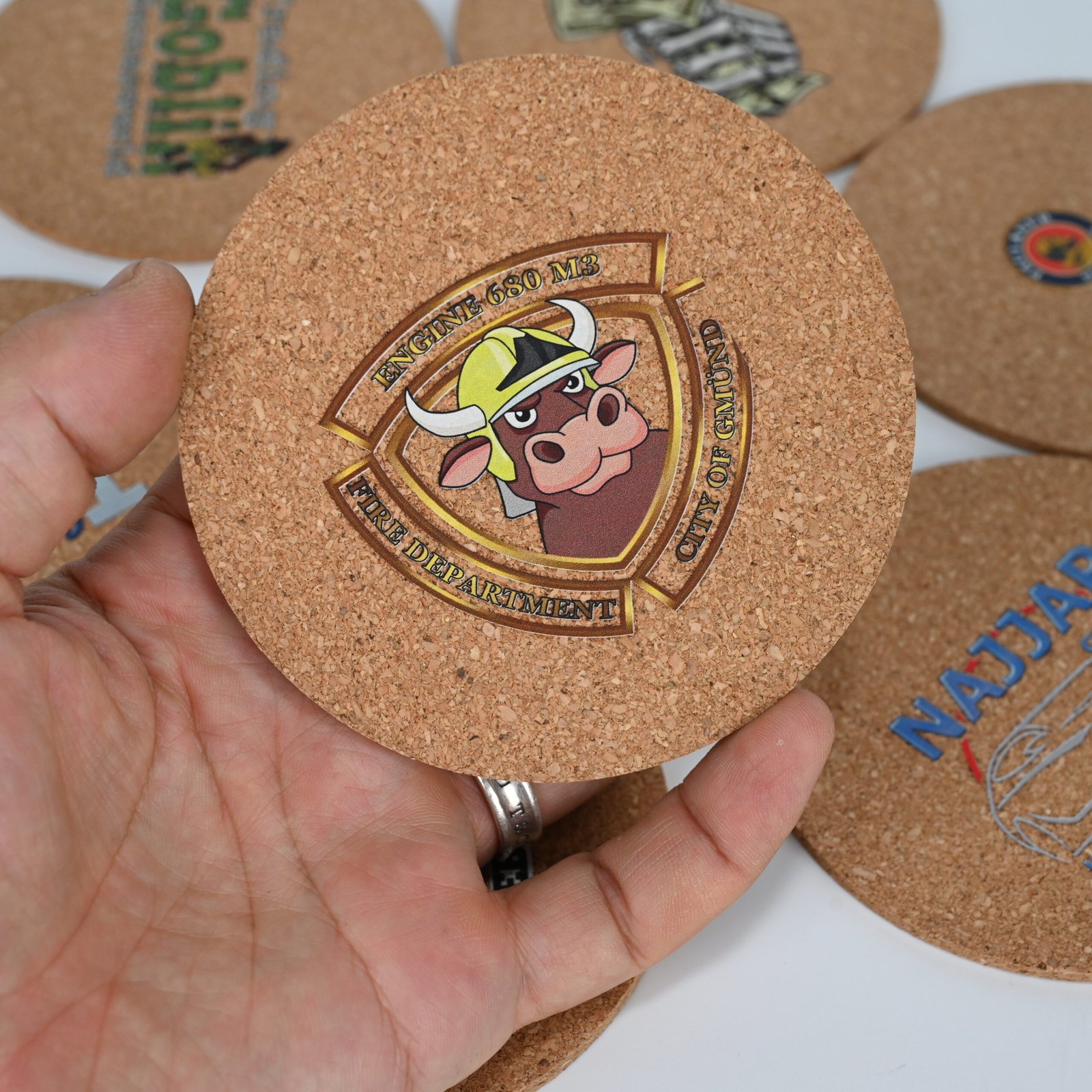 Mixed round and square cork coasters showing diverse custom design capabilities