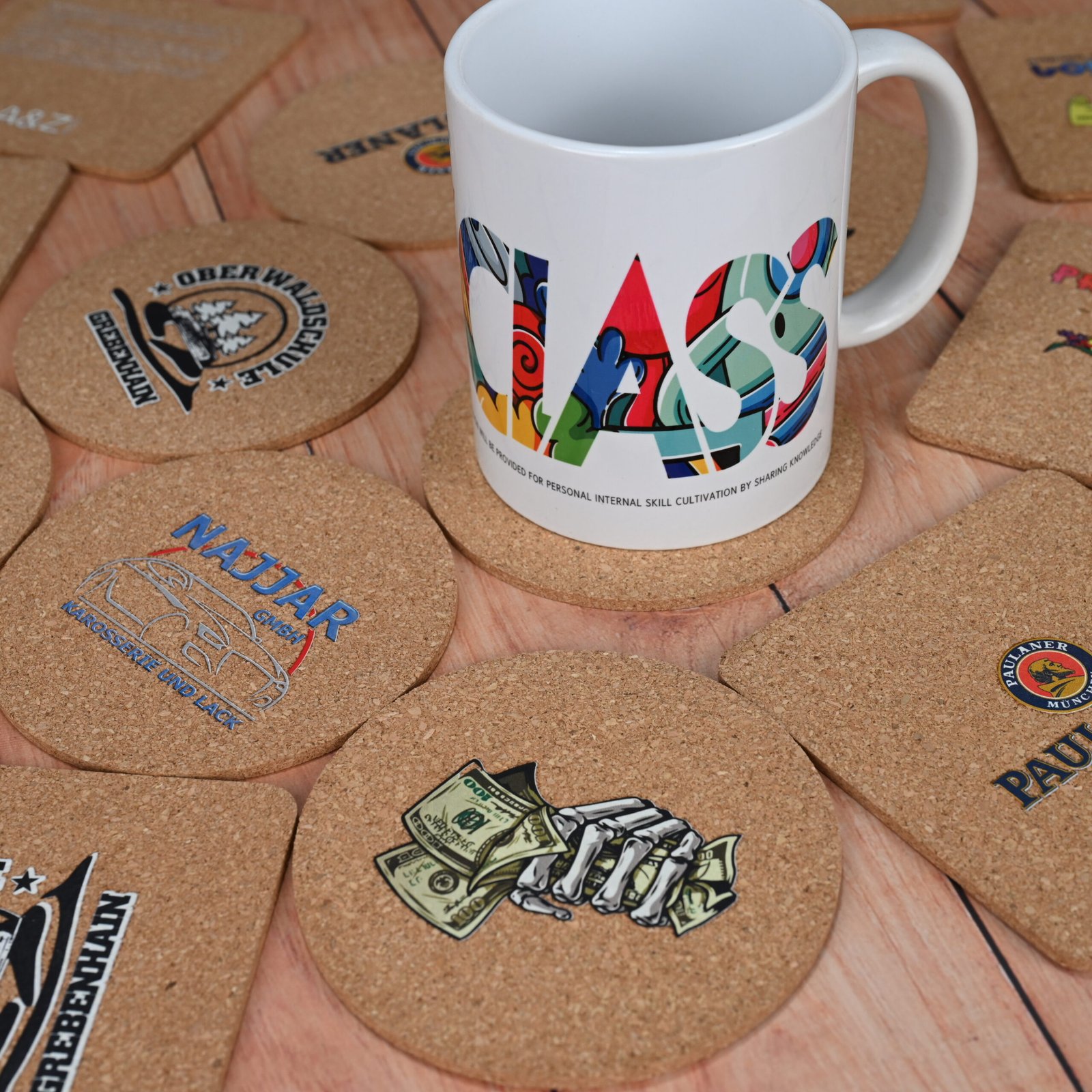 Stack of custom branded cork coasters showing full color print quality