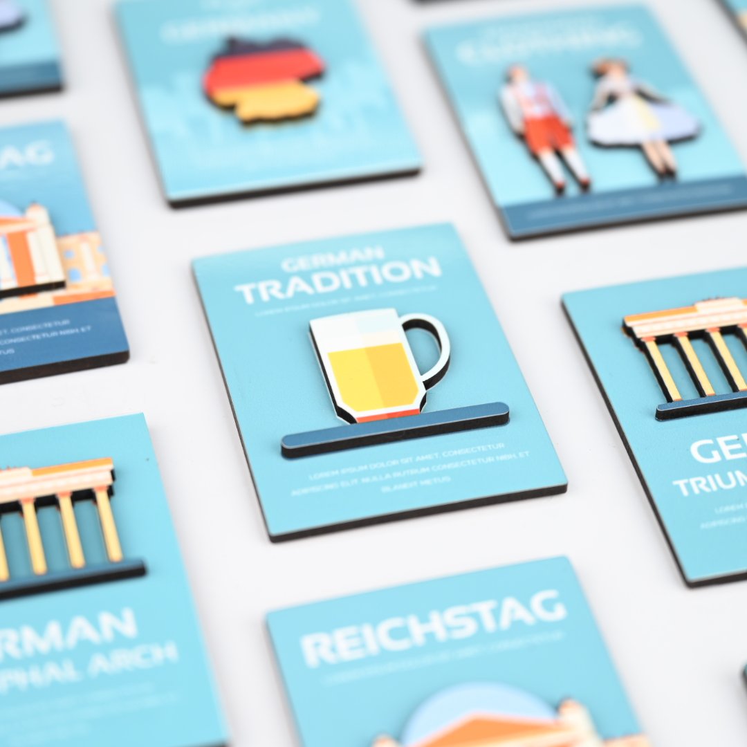 Flat lay of custom double-layer MDF magnets showing variety of client designs