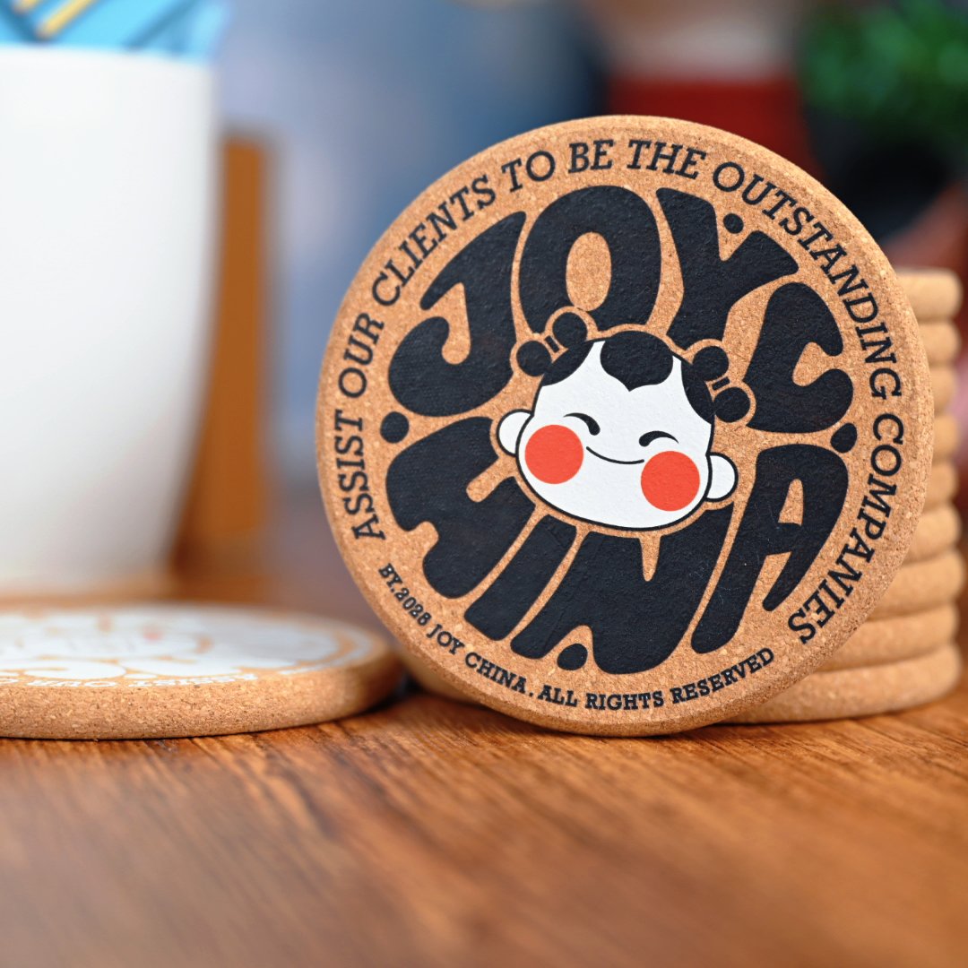 Cork coaster held in hand showing beveled round edge and print quality