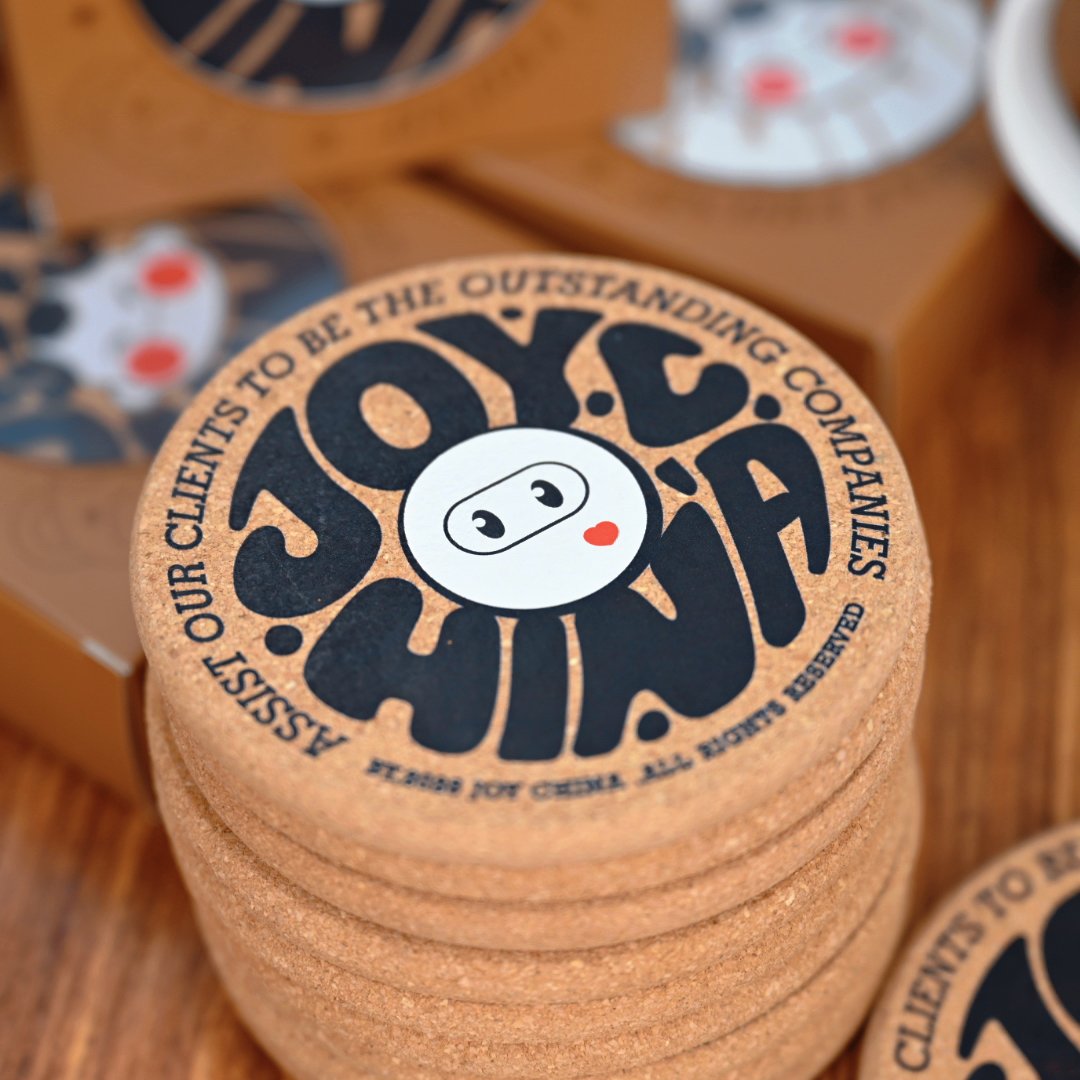 Stacked custom cork coasters closeup showing print quality