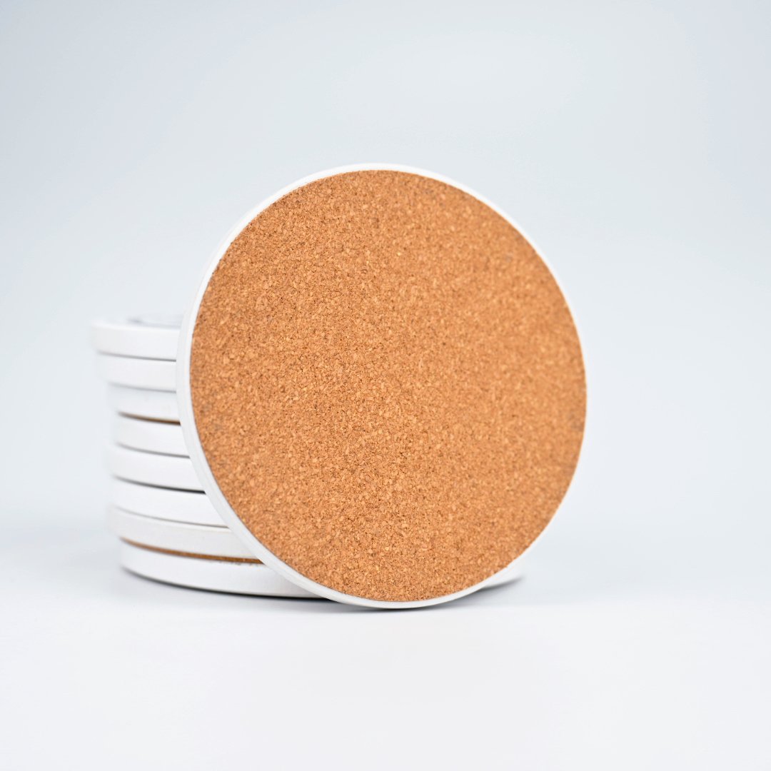 Multiple ceramic coaster designs spread out