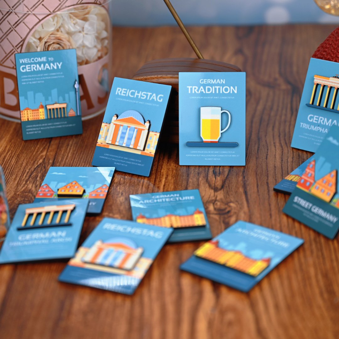 Custom double-layer MDF souvenir fridge magnets spread on wooden surface showing 3D layered effect