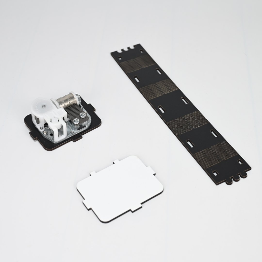 Custom music box showing wind-up key mechanism on back panel