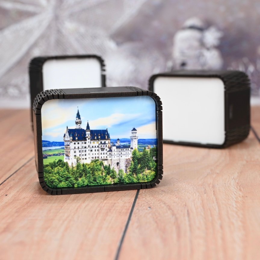 Custom mini music box with full-color printed front panel showing Neuschwanstein Castle — souvenir gift shop product