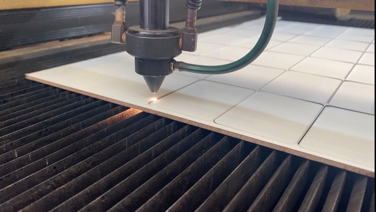 Laser cutting machine cutting MDF for custom souvenirs