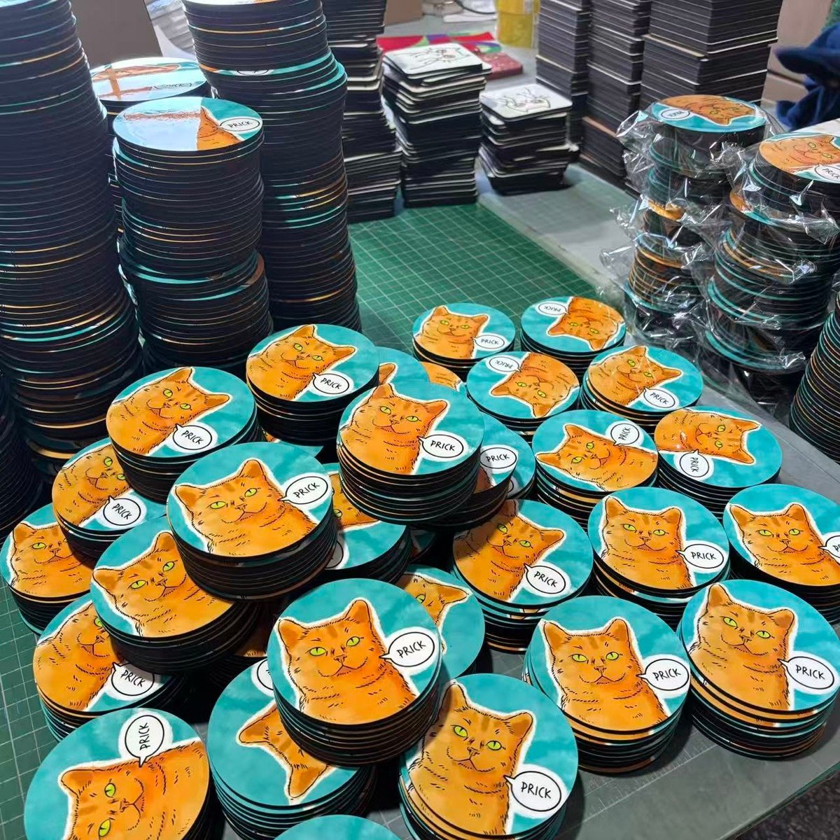 Custom printed coasters stacked and sorted for packing