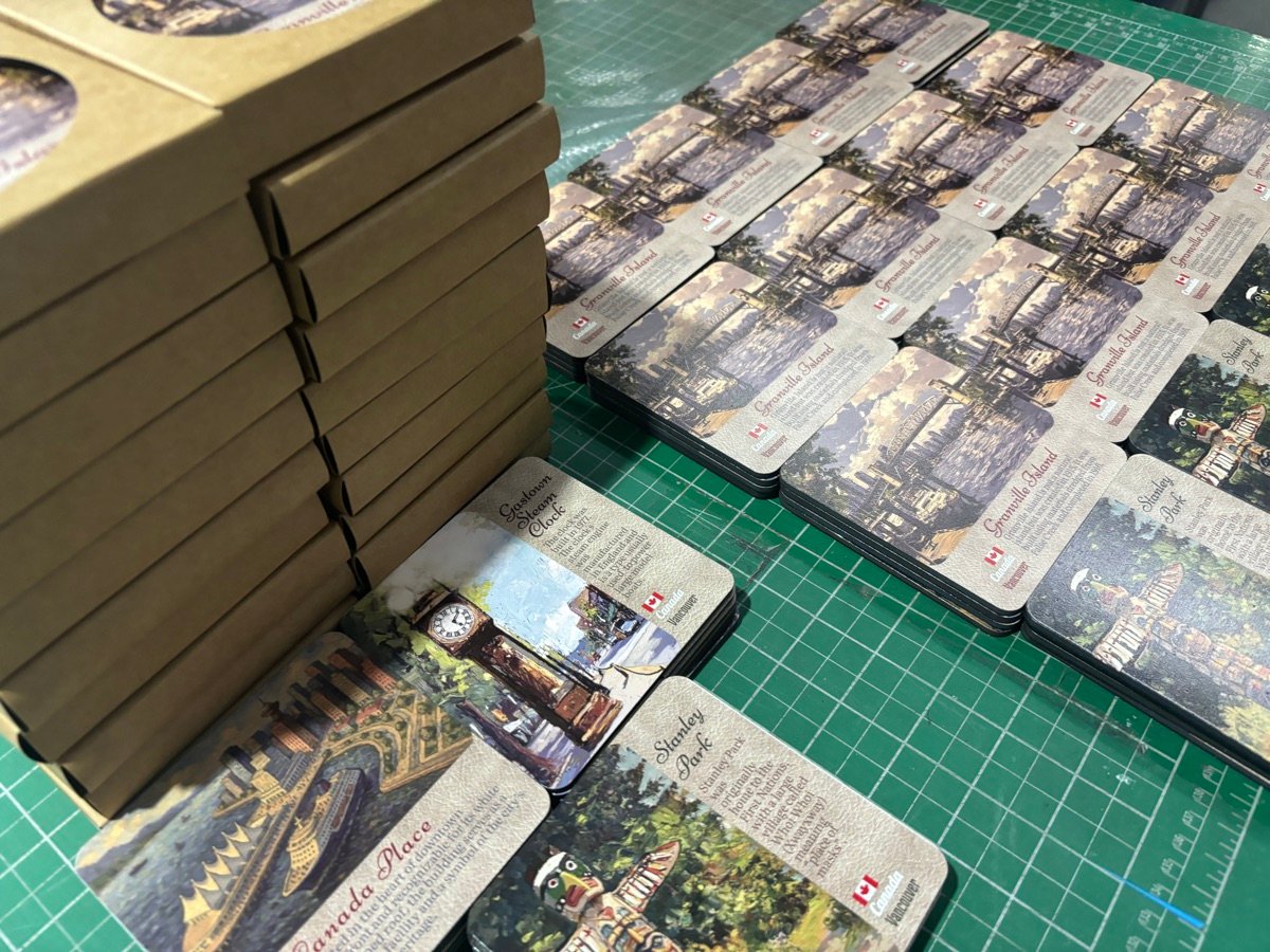 Quality control inspection of custom MDF fridge magnets before packing
